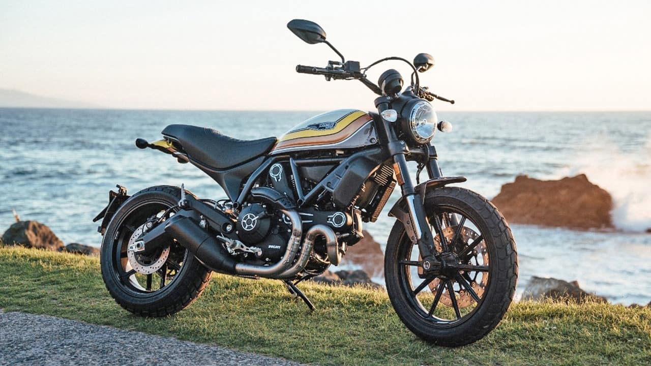 Ducati scrambler by the beachside. This is the main alternative to the triumph