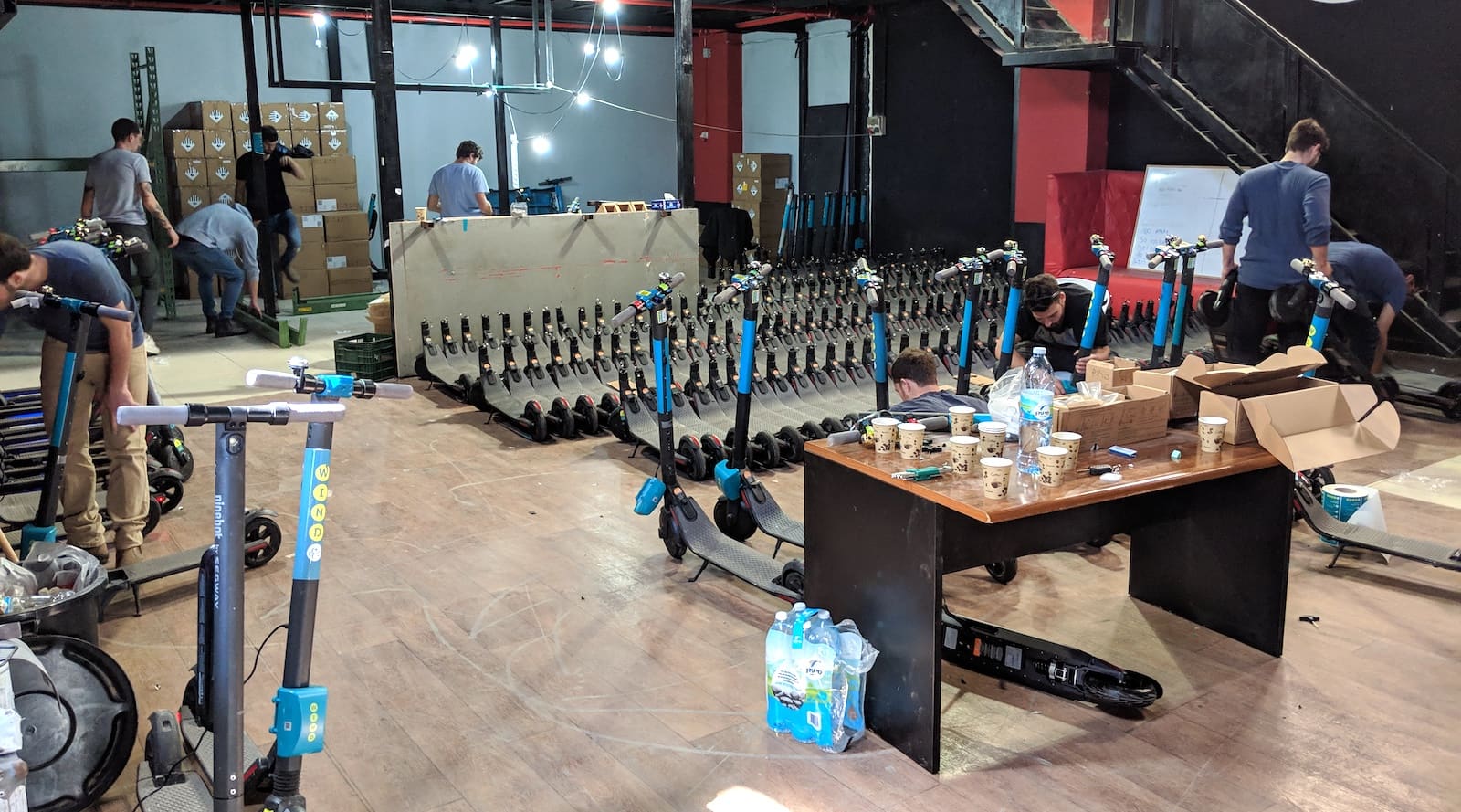 buliding e-scooters for wind, like lime and bird, in the construction warehouse