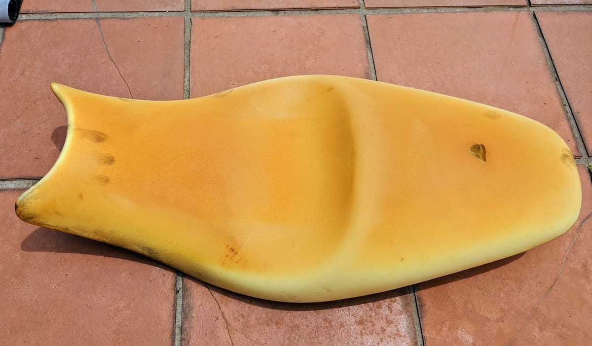 The naked Ninja 650 motorcycle seat - vinyl removed.