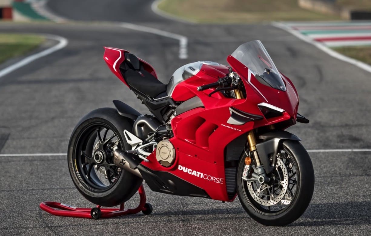 Actual Ducati Panigale V4R, not the Lego version. ON race track, side view.