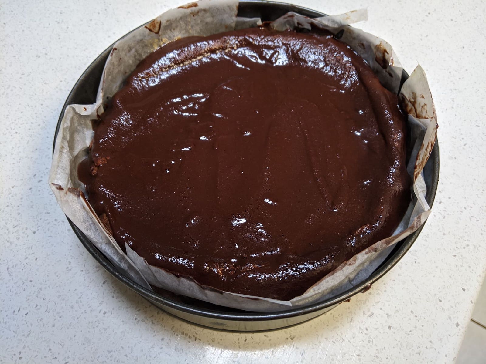 Tartine chocolate soufflé cake with ganache poured over it